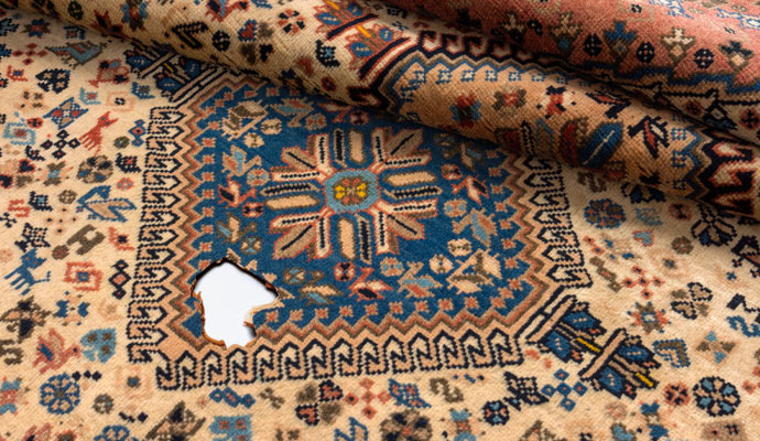 damaged oriental rug