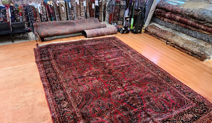 Professional worker cleaning oriental rug